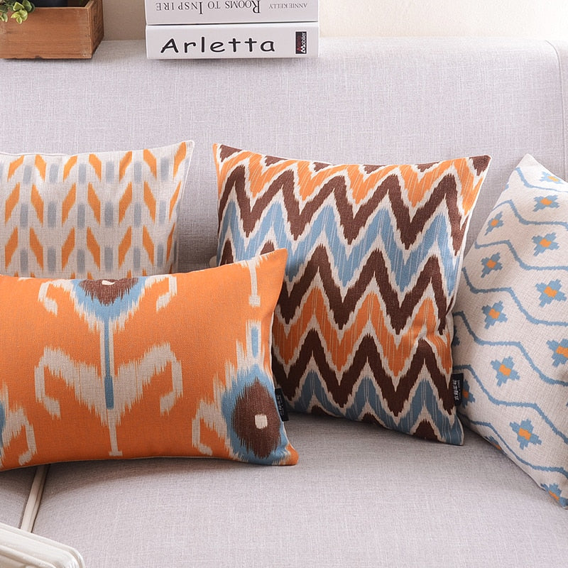 The Clementine + Teal Ikat Pillow Cover Collection